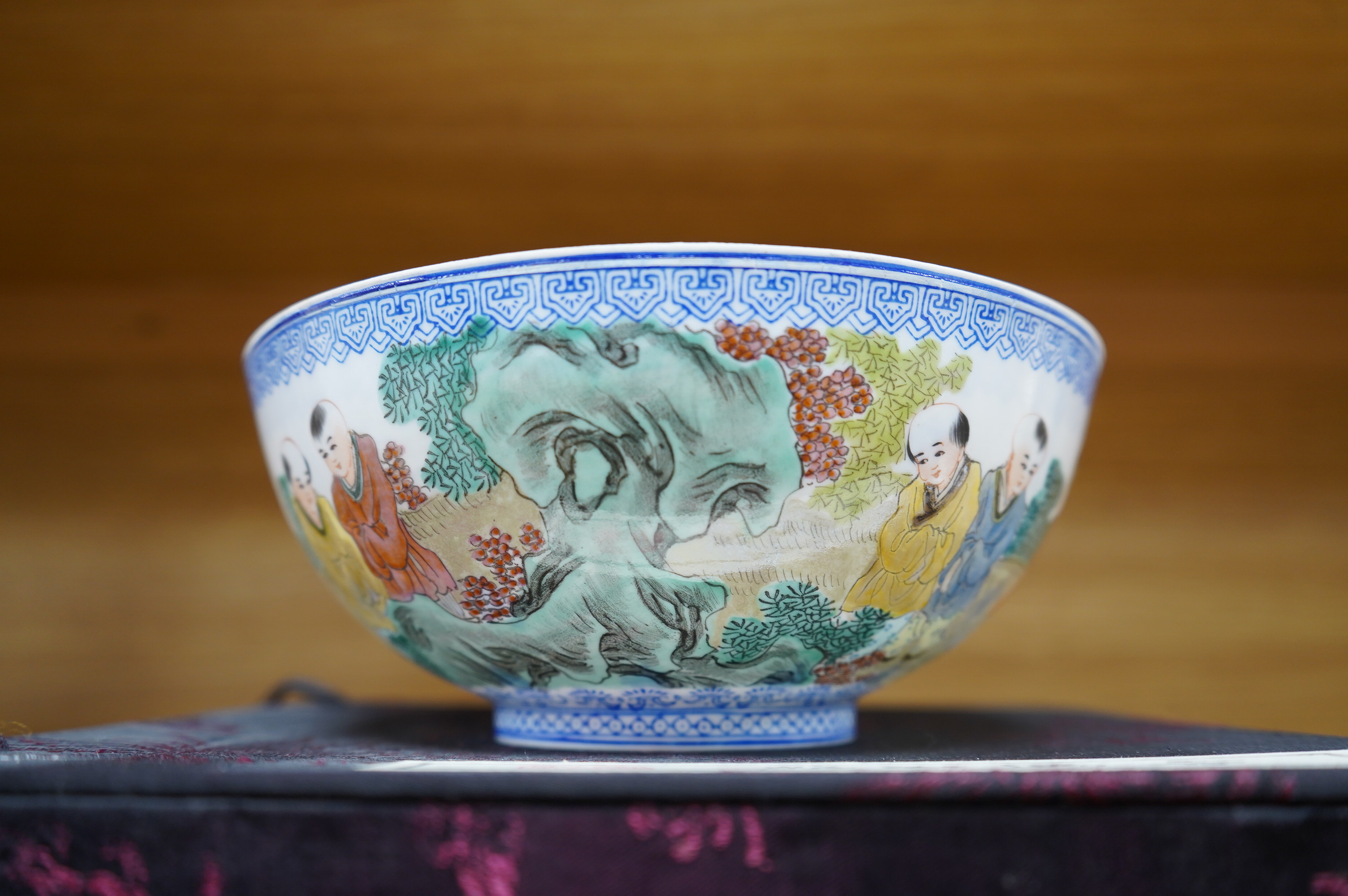 A Chinese eggshell porcelain bowl, 18cm diameter, boxed. Condition - poor, broken and partially repaired